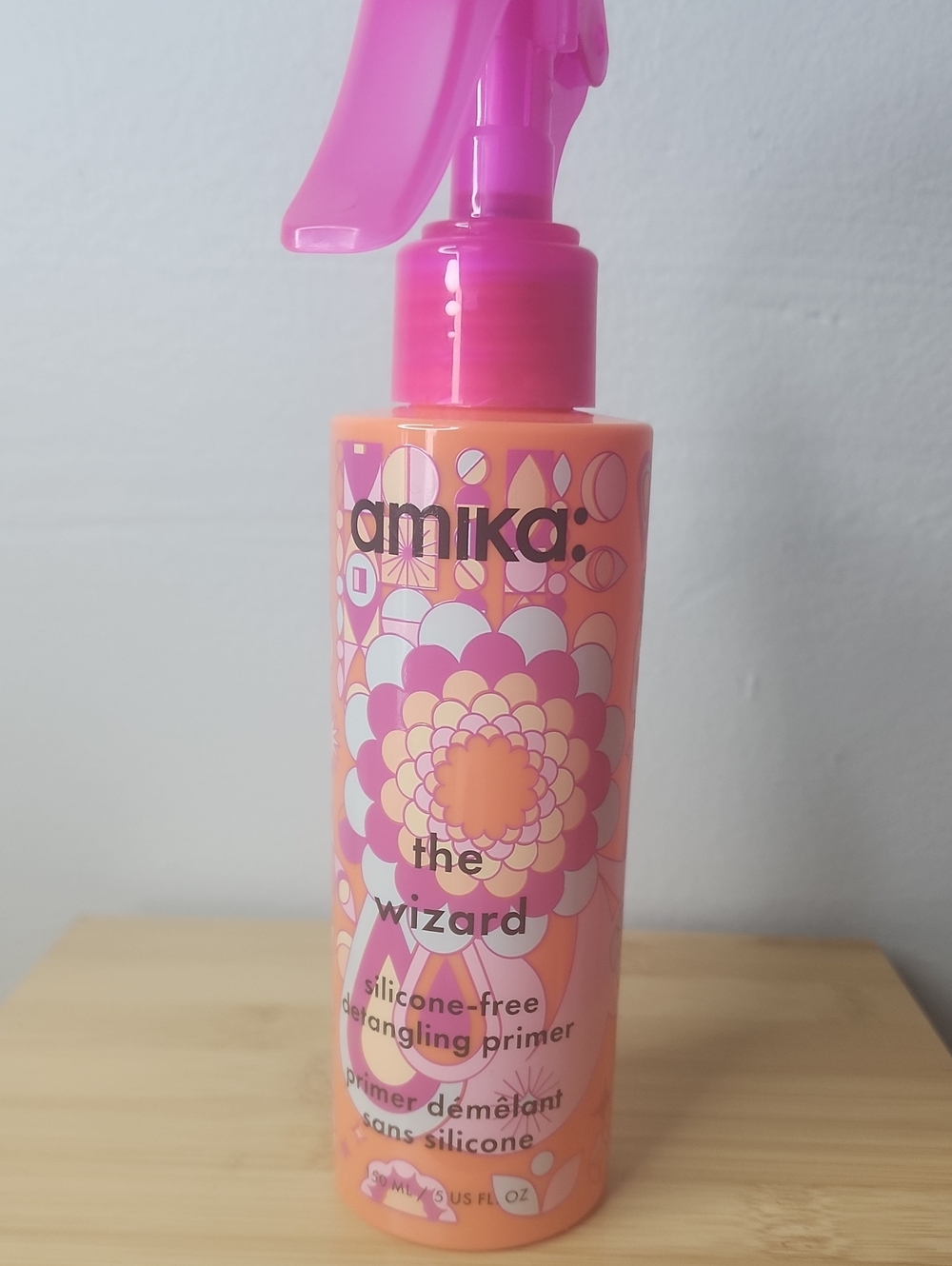 amika Detangling Primer Spray in Pink and Orange